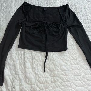 This is a black crop top, size medium/6.